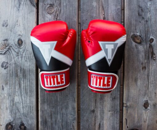 A pair of boxing gloves on a table.