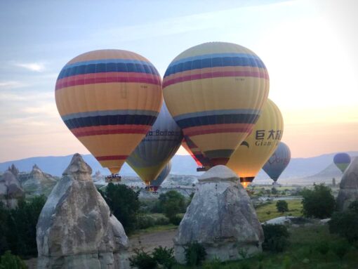 Hot air balloons preparing for flight in Cappadocia, Turkey.