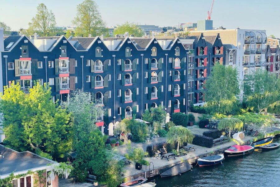 Converted Amsterdam canal warehouses to hip residential apartments.