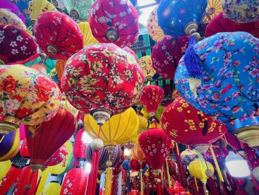 Colourful Chinese lanterns handing on a ceiling. 