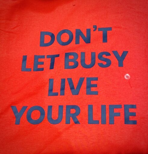 Tshirt slogan that reads: Don't let busy live your life.