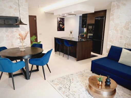 Modern interior of an apartment with cooking island. 