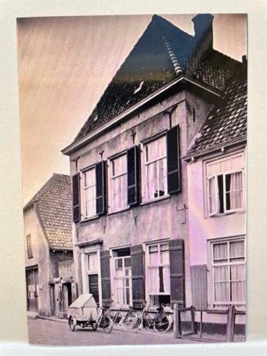 B&w photo of a heritage house with impressive frontage.